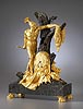 A magnificent Empire gilt and patinated bronze and vert de mer marble mantle clock of eight day duration with case representing Jason and the Golden Fleece attributed to Pierre-François Feuchère